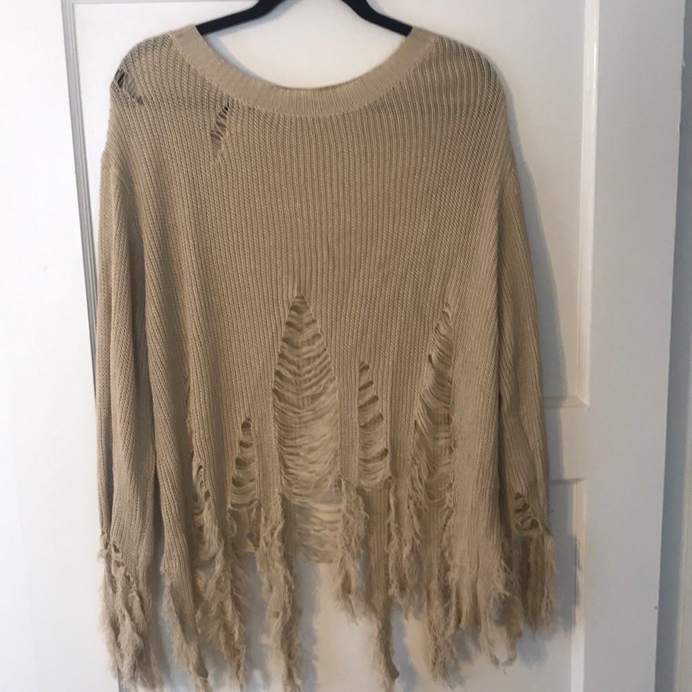 Cream “ripped” sweater